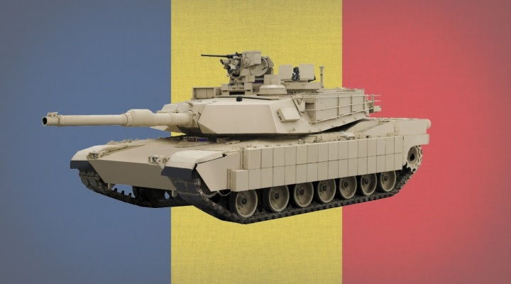 american m1 abrams tank with romanian flag in background